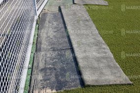 mats underneath fake grass
